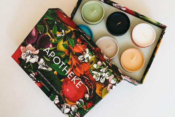 Gift box with six assorted scented candles in colorful floral packaging