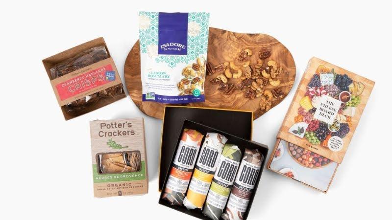 Luxury gift set with crackers, crisps, mixed nuts, cheese board, and assorted sausage in box