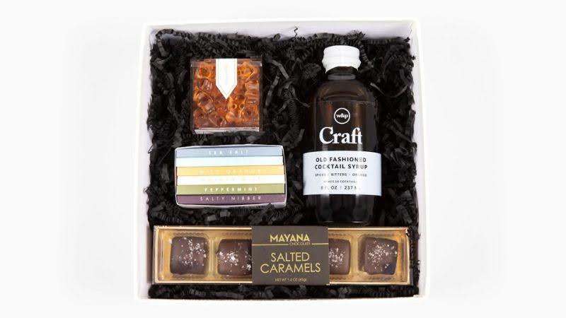 Curated white gift box with salted caramels, honeycomb candy, cocktail syrup, assorted teas