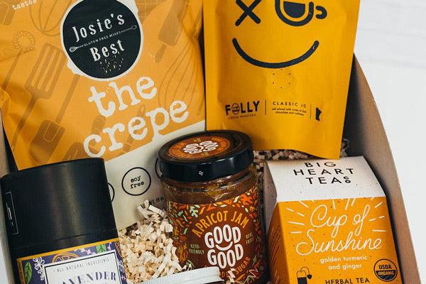 Gourmet food gift box with crepe mix, coffee, apricot jam, herbal tea, and lavender salt
