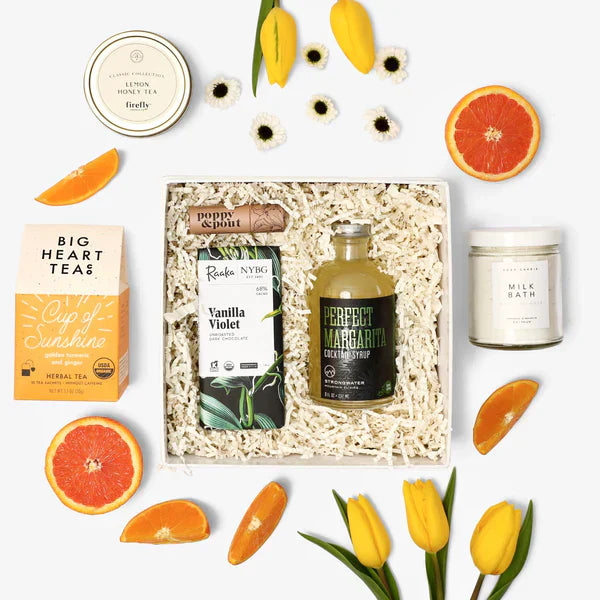 Premium gift box with tea, vanilla chocolate, margarita syrup, bath soak, and fresh fruit