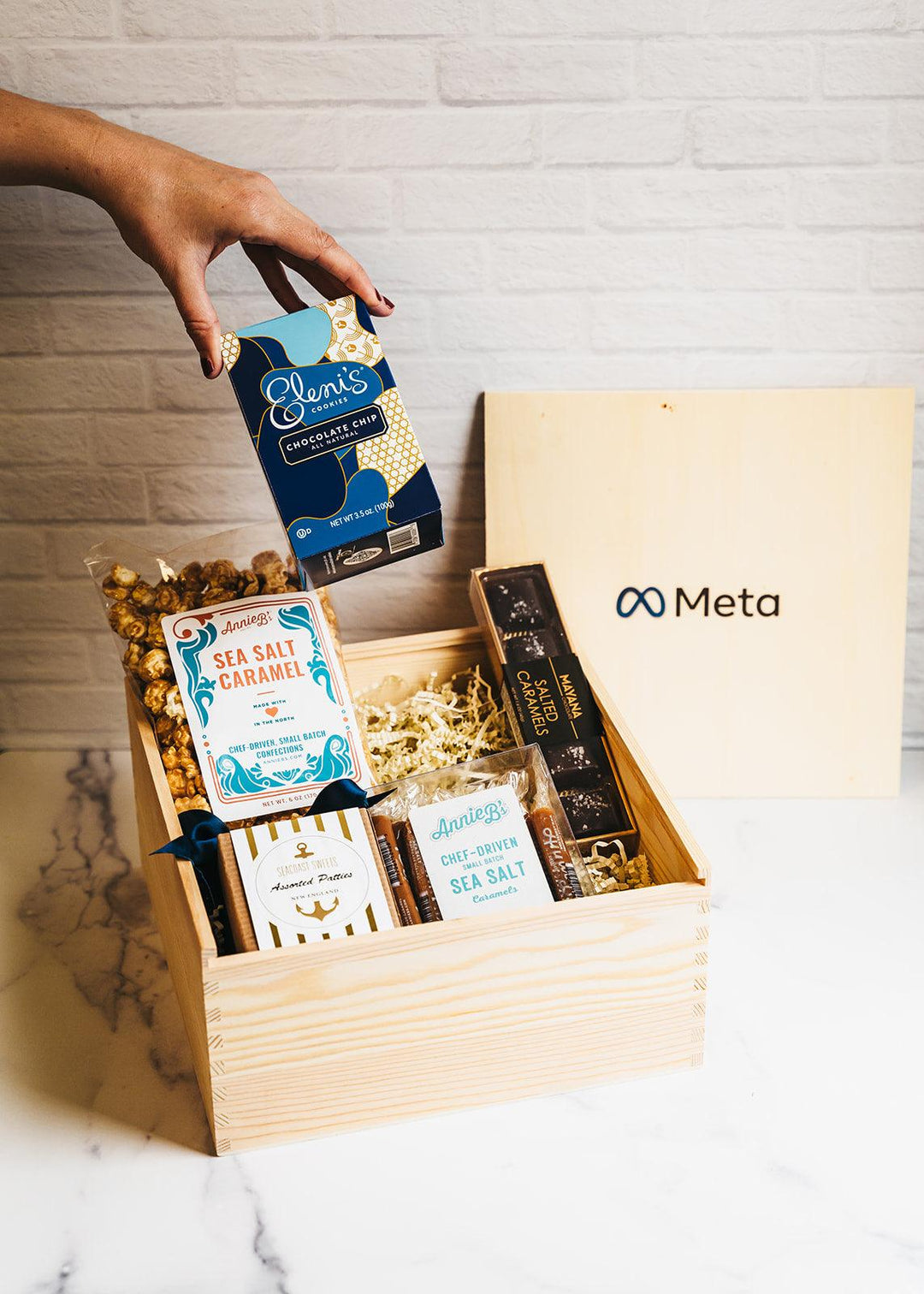 Premium wooden gift box with cookies, sea salt caramel, popcorn, and assorted snacks
