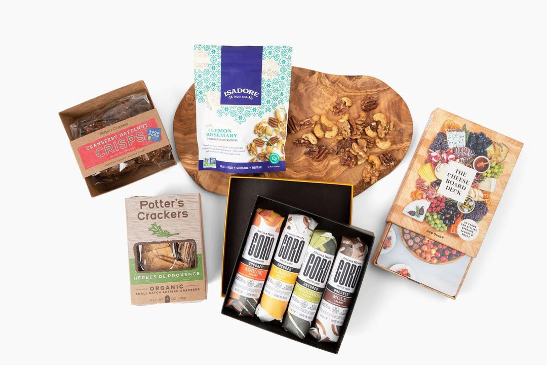 Premium gift box with gourmet crackers, nuts, artisan meats, crisps, and cheese board book