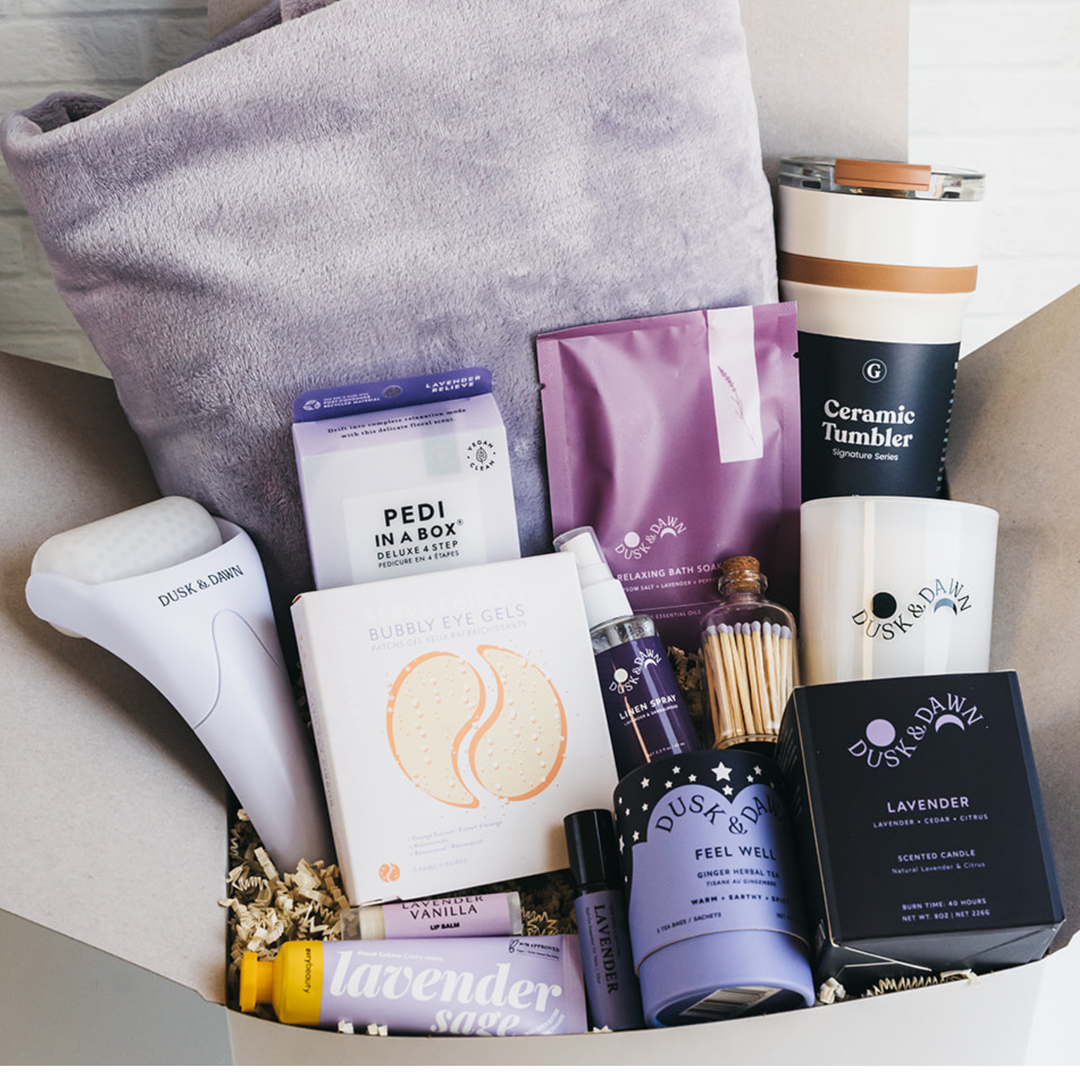 Lavender-themed gift box with blanket, candle, tumbler, snacks, self-care and wellness items