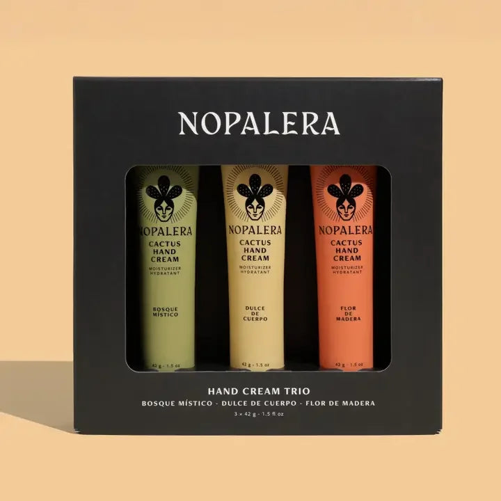 Hand cream trio gift set in black box with three colorful moisturizer tubes visible