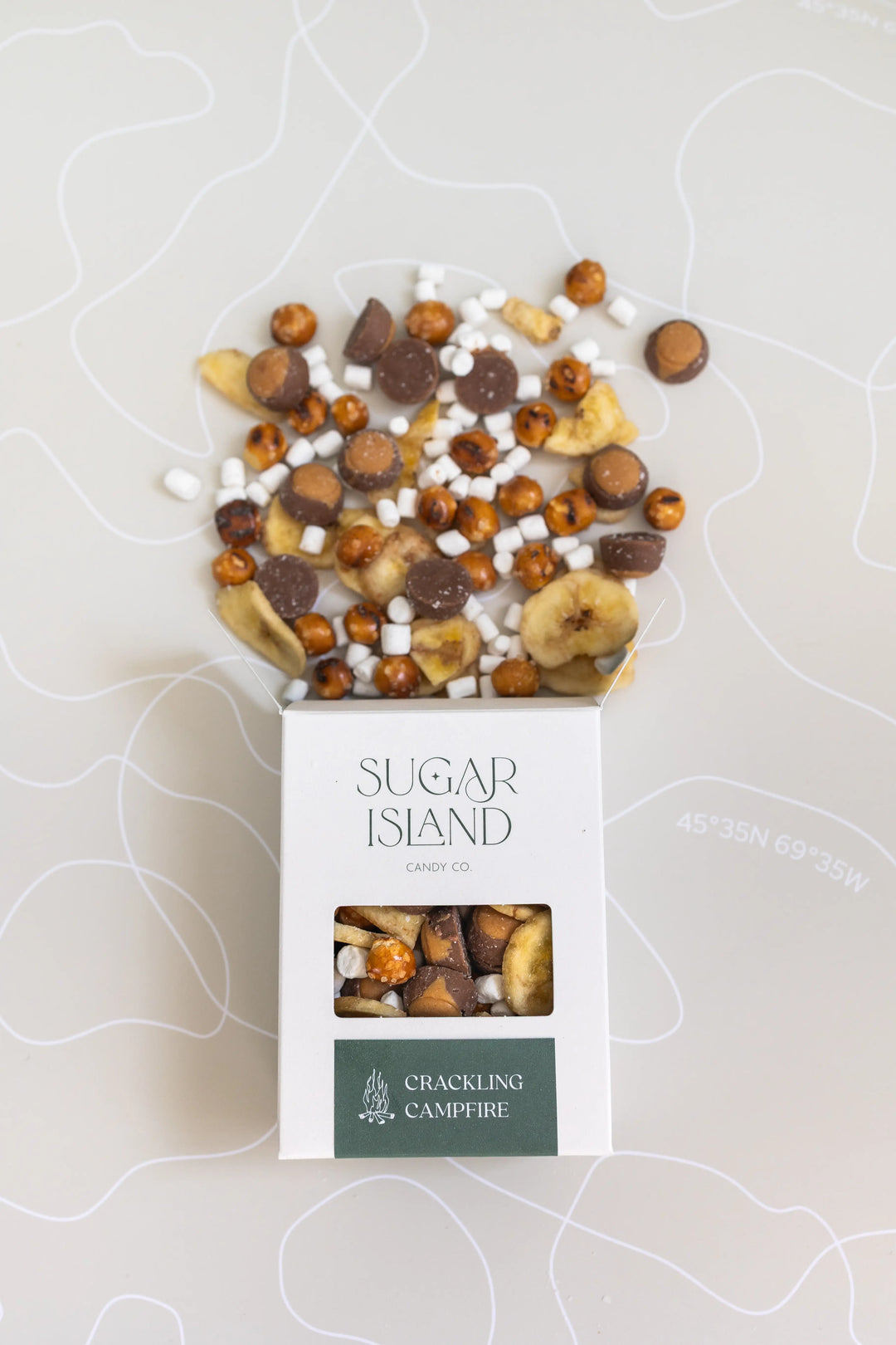 Open Crackling Campfire box with marshmallows, buckeyes and banana chips spilling out the top