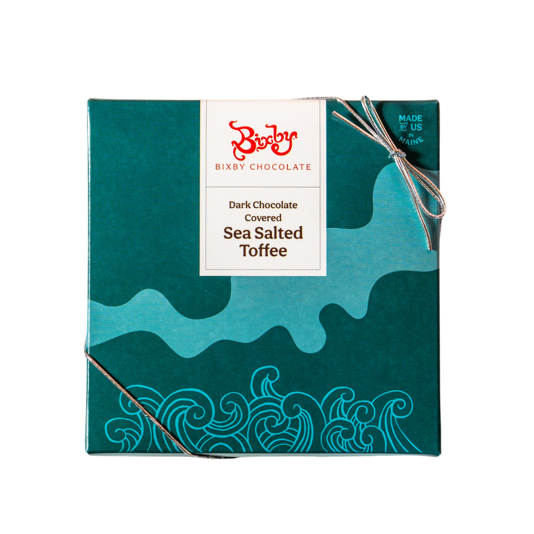 Teal Bixby Dark Chocolate Covered Sea Salted Toffee gift box with a wave pattern, tied with string