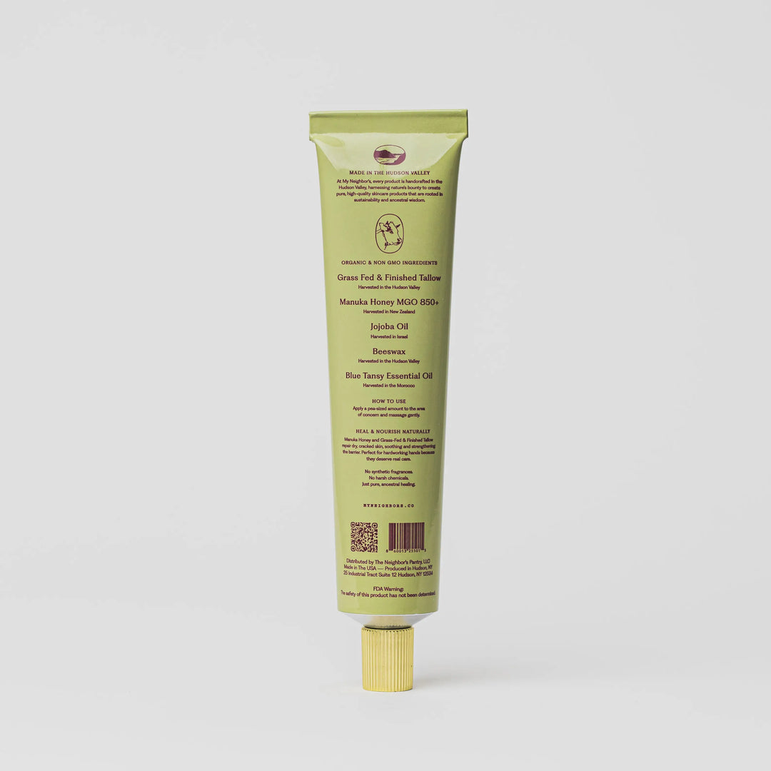 Back of the sage green hand balm tube showing the ingredient panel