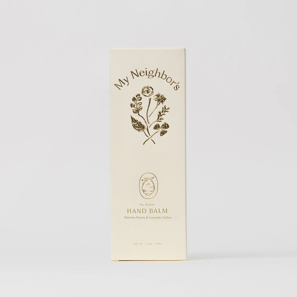 Cream My Neighbor's hand balm carton with a floral illustration