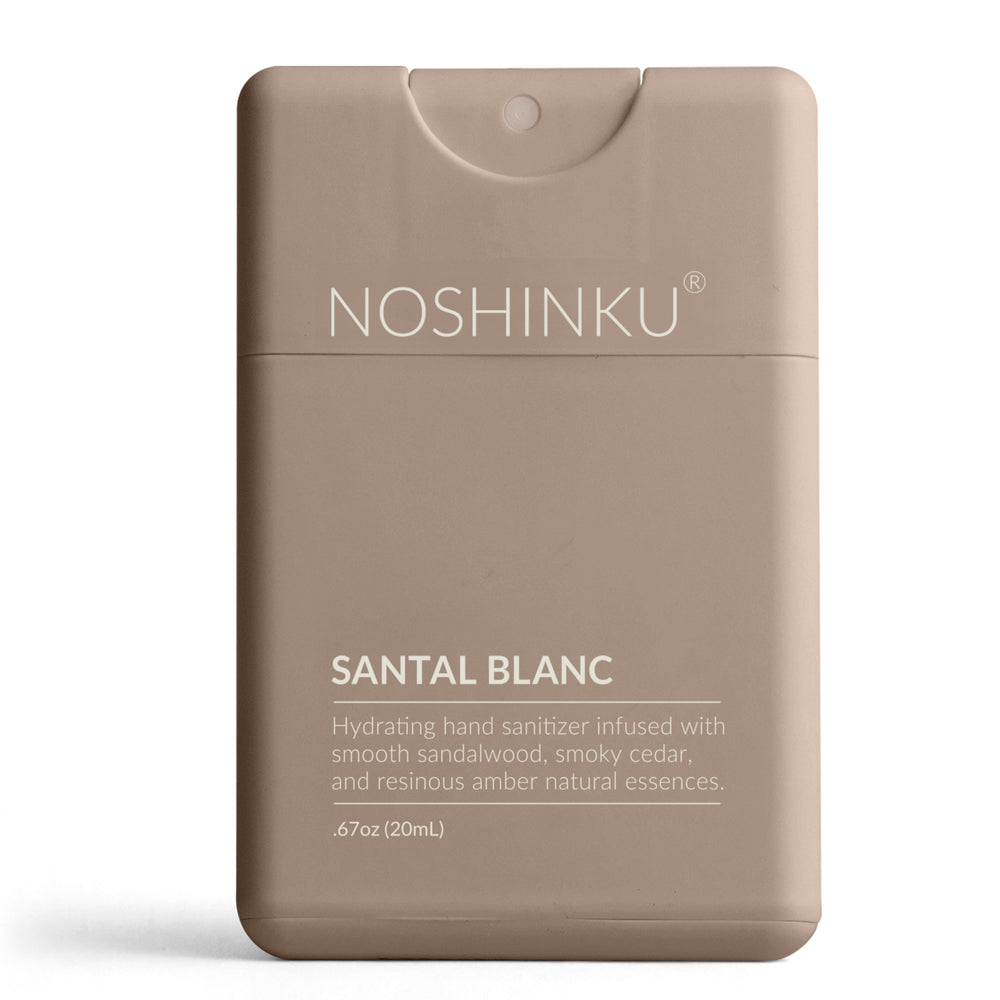 Taupe Noshinku Santal Blanc pocket sanitizer standing on a white background