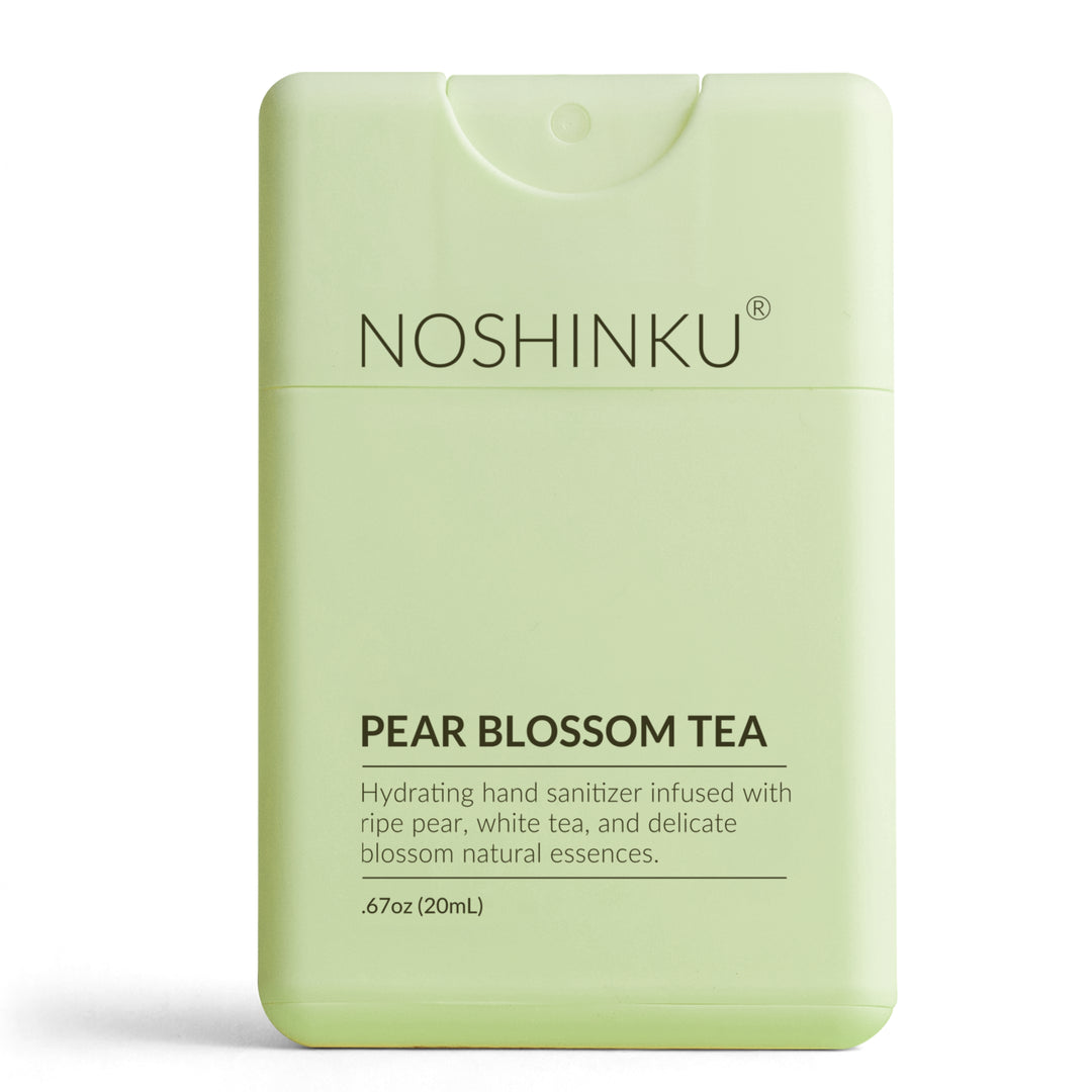 Pale green Noshinku Pear Blossom Tea pocket sanitizer standing on a white background