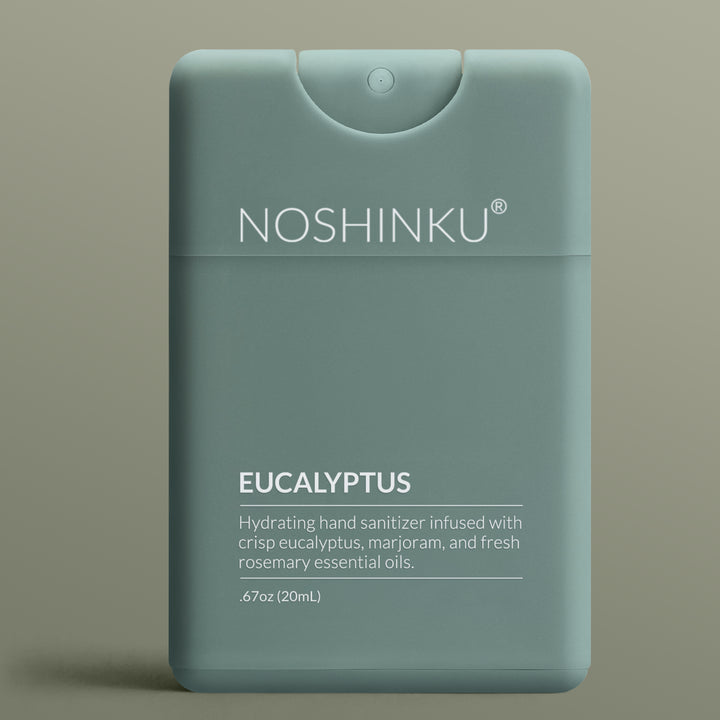 Sage green Noshinku Eucalyptus pocket hand sanitizer on a sage background