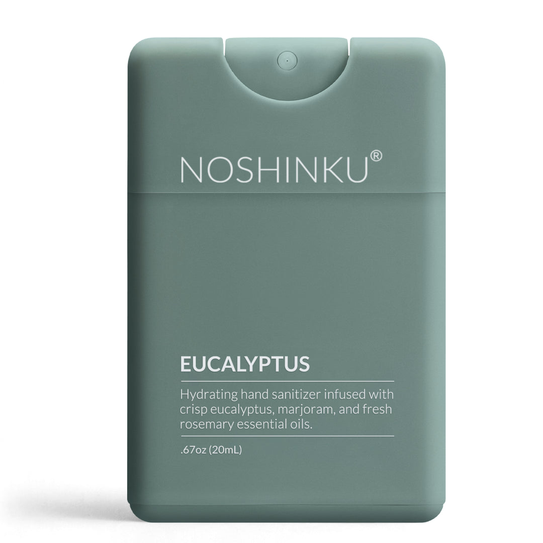 Sage green Noshinku Eucalyptus pocket sanitizer standing on a white background