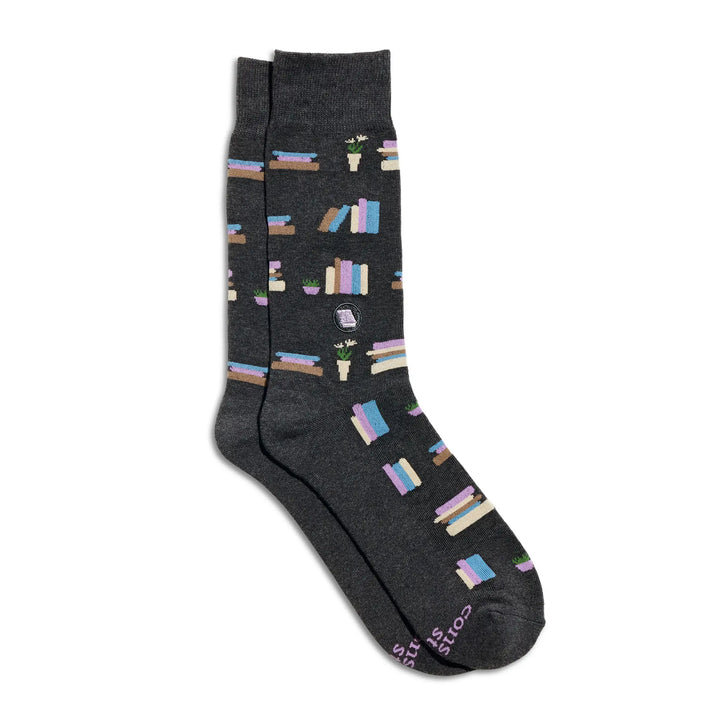 Pair of charcoal crew socks patterned with colorful stacks of books