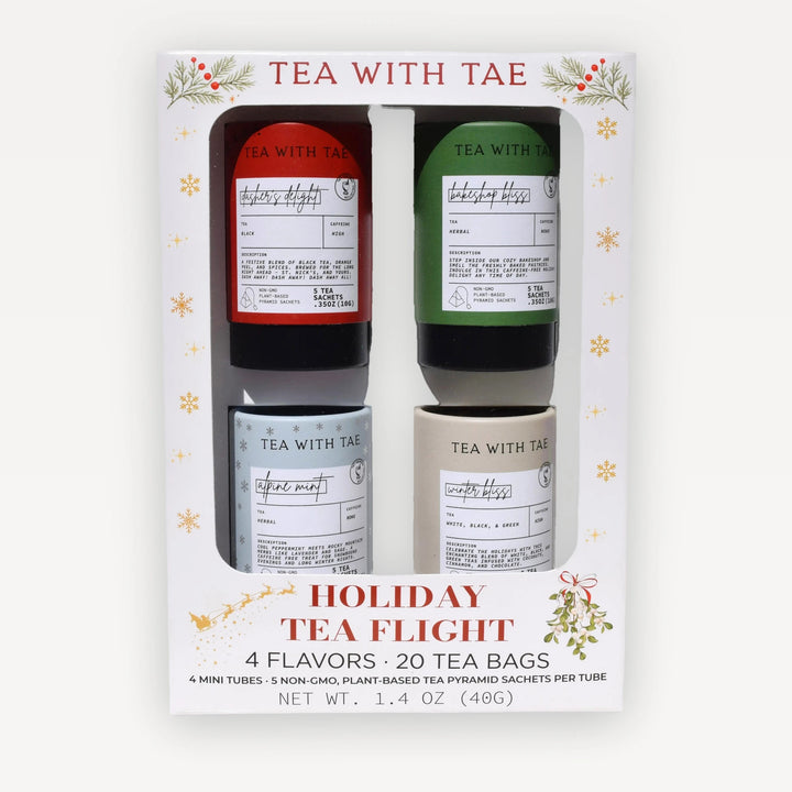 Tea with Tae Holiday Tea Flight gift box with a window showing four mini tea tubes, on white
