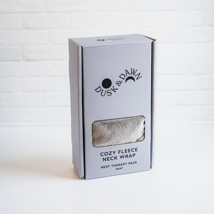 Dusk &amp; Dawn Cozy Fleece Neck Wrap in its gray gift box, front view