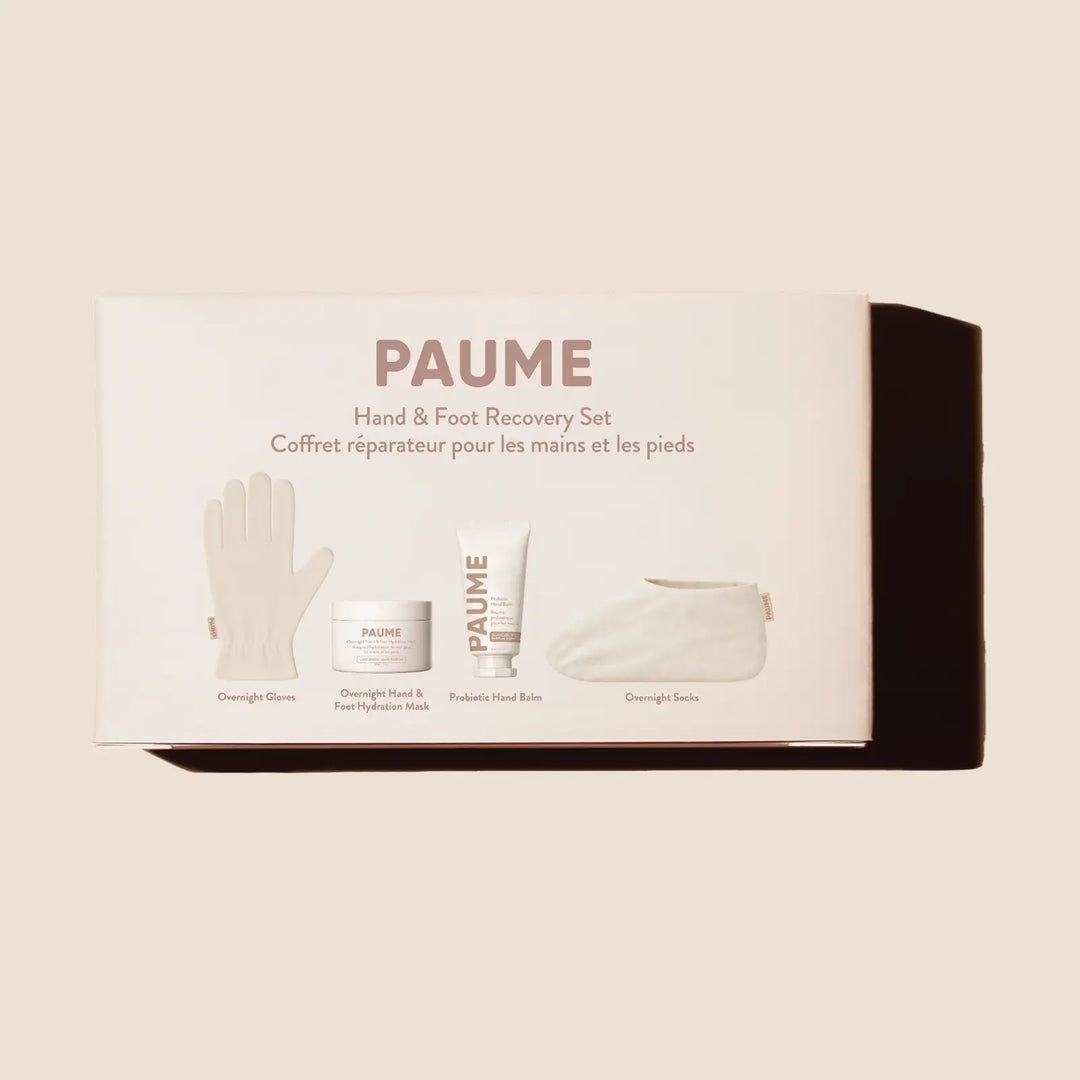 Front of the blush pink PAUME Hand &amp; Foot Recovery Set box, printed with the cotton overnight glove, hydration mask jar, hand balm tube, and cotton overnight sock