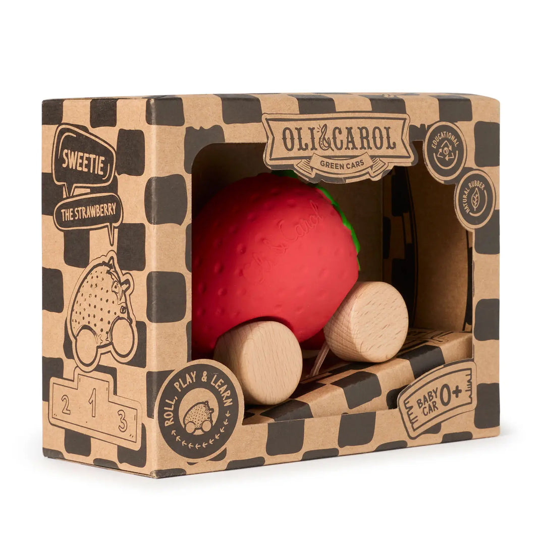 Kraft cardboard box angled to show the strawberry car inside and the ramp folded below.