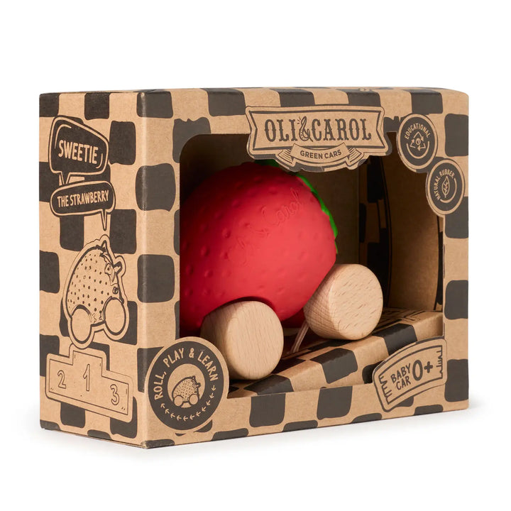 Kraft cardboard box angled to show the strawberry car inside and the ramp folded below.