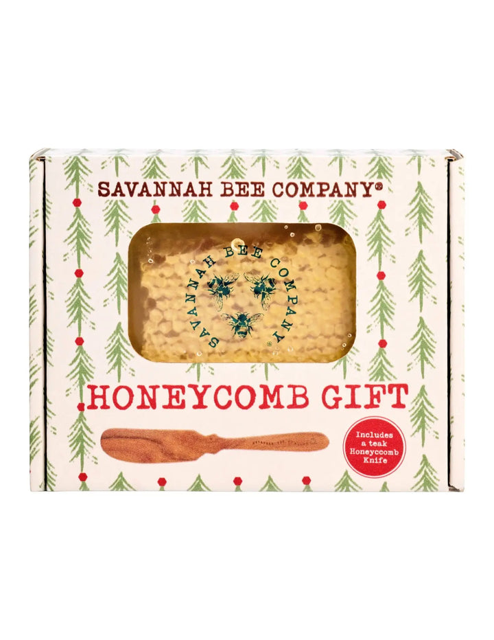 Savannah Bee Company Honeycomb Gift box with an evergreen pattern, a window showing raw honeycomb, and an illustration of the teak knife