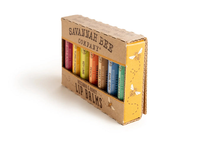 Kraft lip balm box standing at an angle, with bee illustrations on the side panel