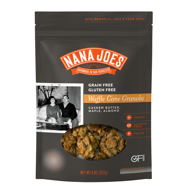 Front of the Nana Joes Waffle Cone Granola bag in charcoal gray, labeled grain free and gluten free, with a window showing granola clusters