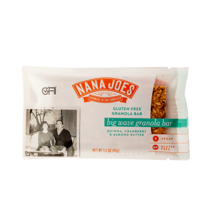 Nana Joes Big Wave granola bar in a clear wrapper labeled quinoa, cranberry and almond butter, with a vintage family photo
