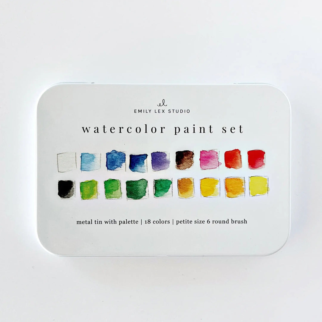 Closed white metal watercolor paint set tin printed with two rows of painted color swatches