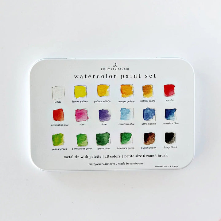 Back of the watercolor tin with a labeled swatch chart of all 18 colors