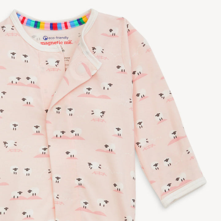 Pink baby footie with sheep print and magnetic closure, shown on a white background