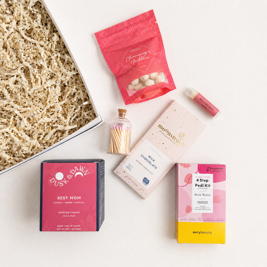 Collection of beauty products and snacks on a white background