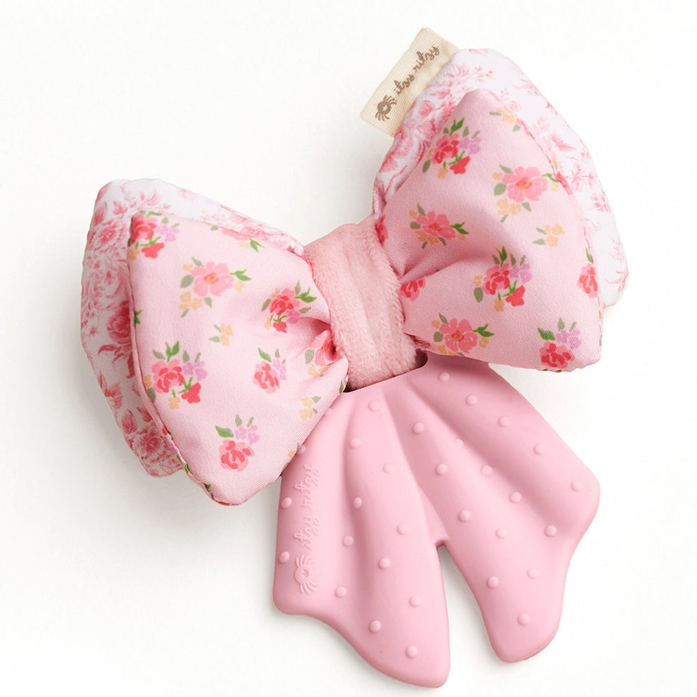 Pink floral bow baby teether with soft fabric top and textured silicone bottom