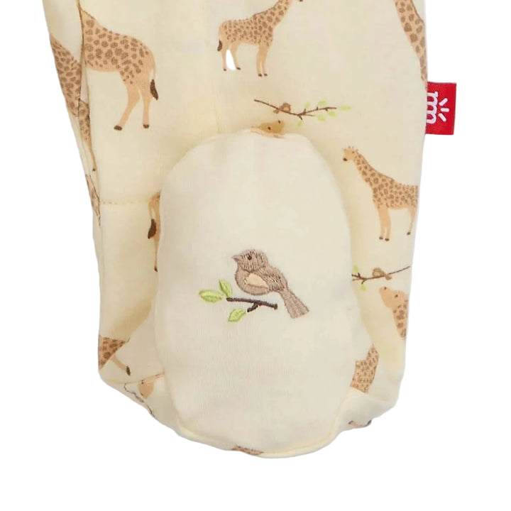 Cream baby footie with giraffe print and embroidered bird on the foot