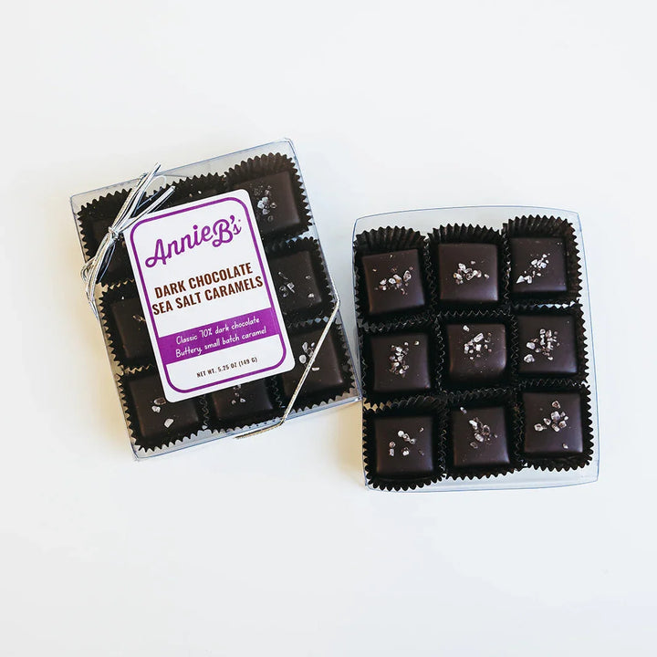 Dark chocolate caramels in a clear packaging with a visible label on a white background