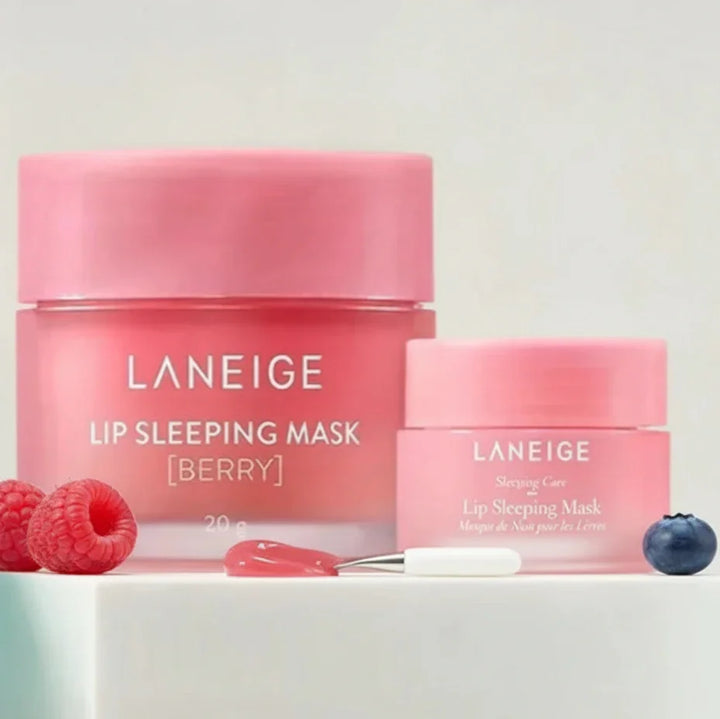 Two pink Laneige lip sleeping masks with berries on a white background