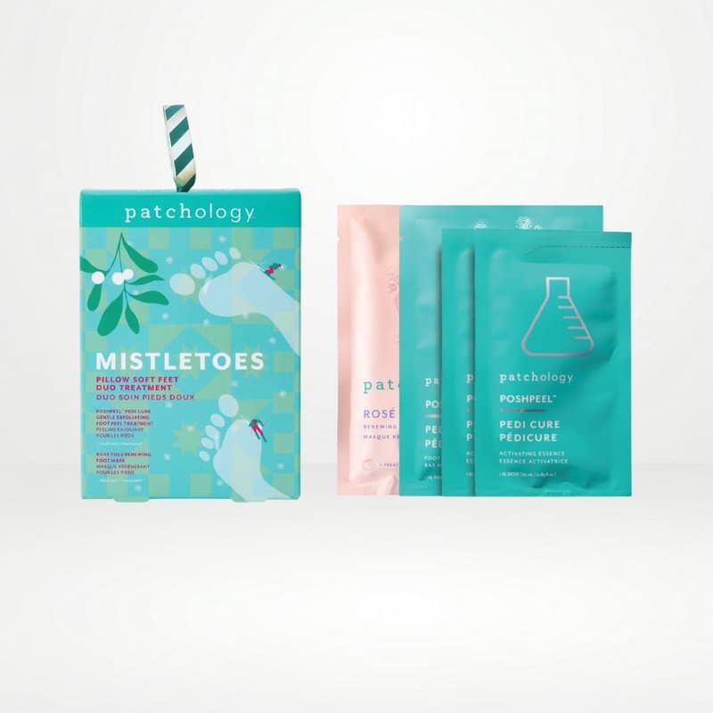 Mistletoes foot care set with a teal box, a pink foot mask packet, and two teal peel pouches on white