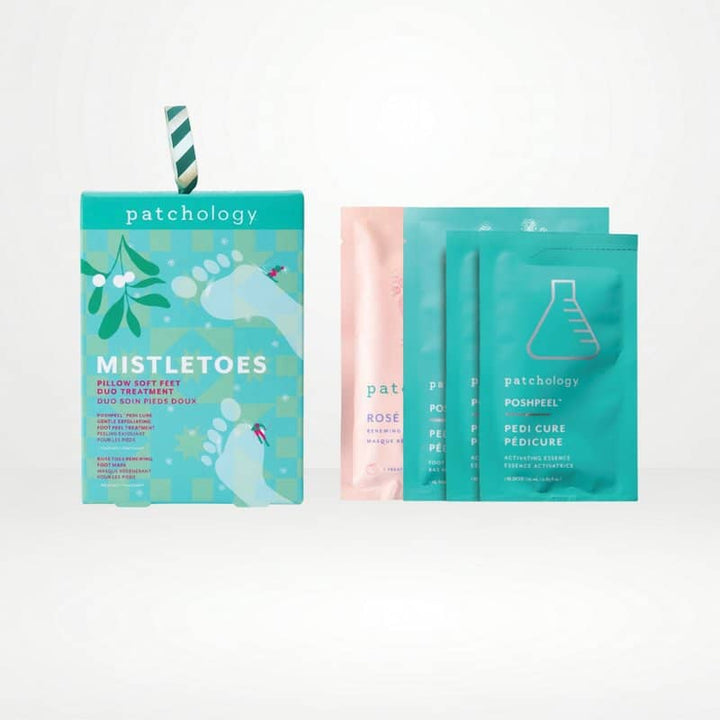 Mistletoes foot care set with a teal box, a pink foot mask packet, and two teal peel pouches on white