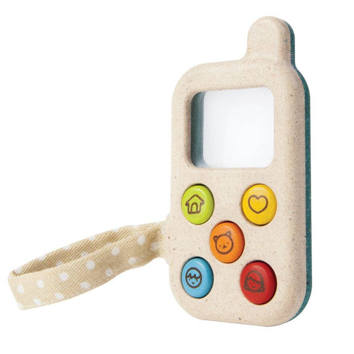 Toy phone with colorful buttons on a white background