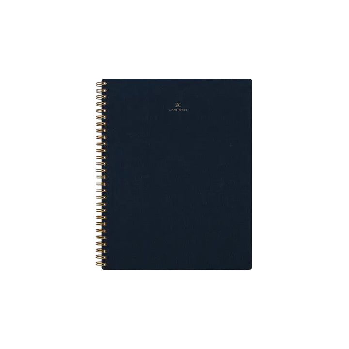 Dark blue spiral-bound notebook on a white background