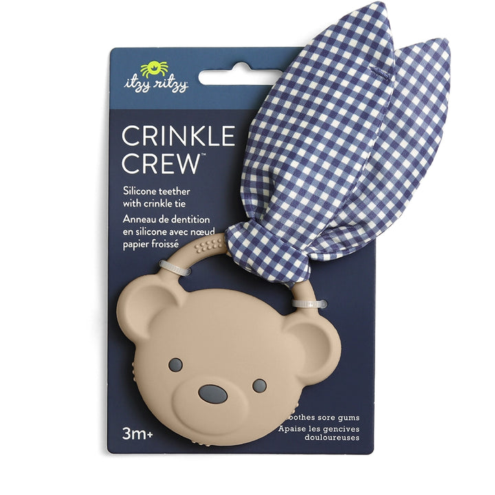 Bear-shaped silicone baby teether with blue gingham crinkle fabric ears in retail packaging