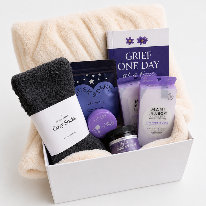 Gift set with Cozy Socks, Mani in a Box, and other items on a white background