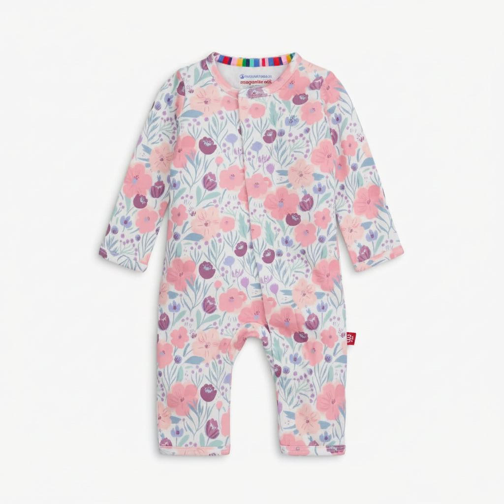 Floral patterned baby onesie on a white background