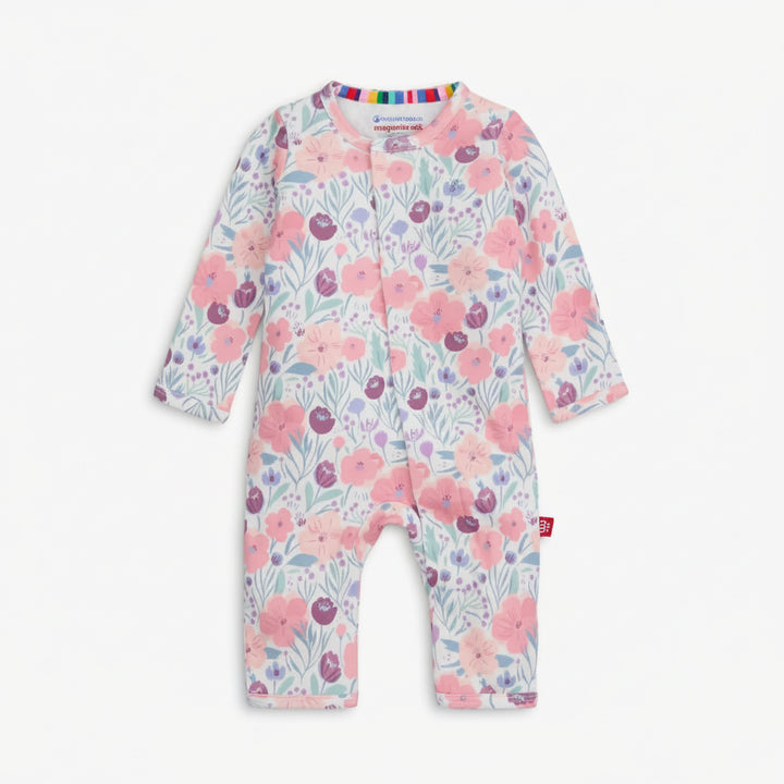 Floral patterned baby onesie on a white background