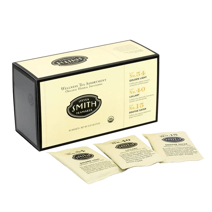 Assortment box of organic herbal tea sachets with three individual packets displayed