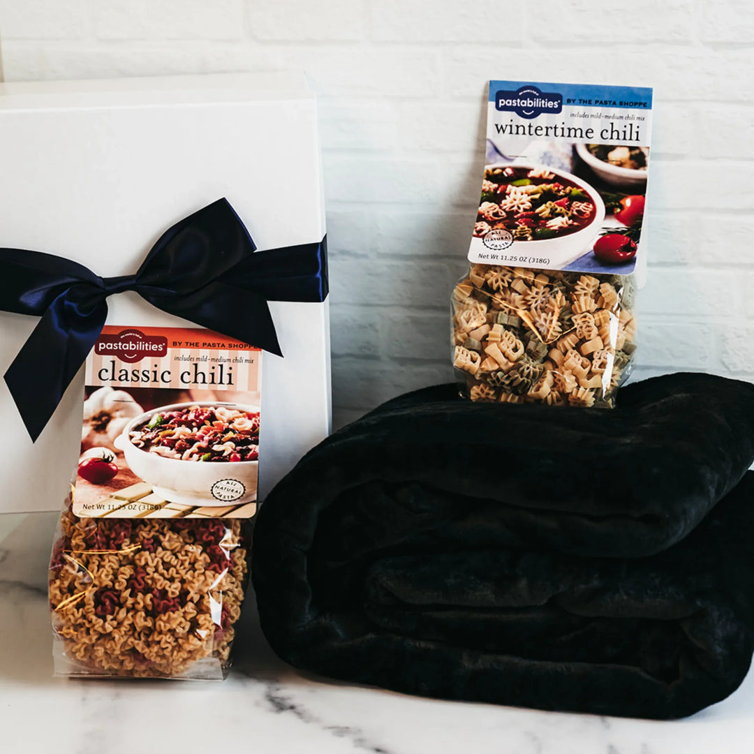 Winter Warm-Up Gift Box with chili, chicken noodle soup, and cozy fleece blanket.
