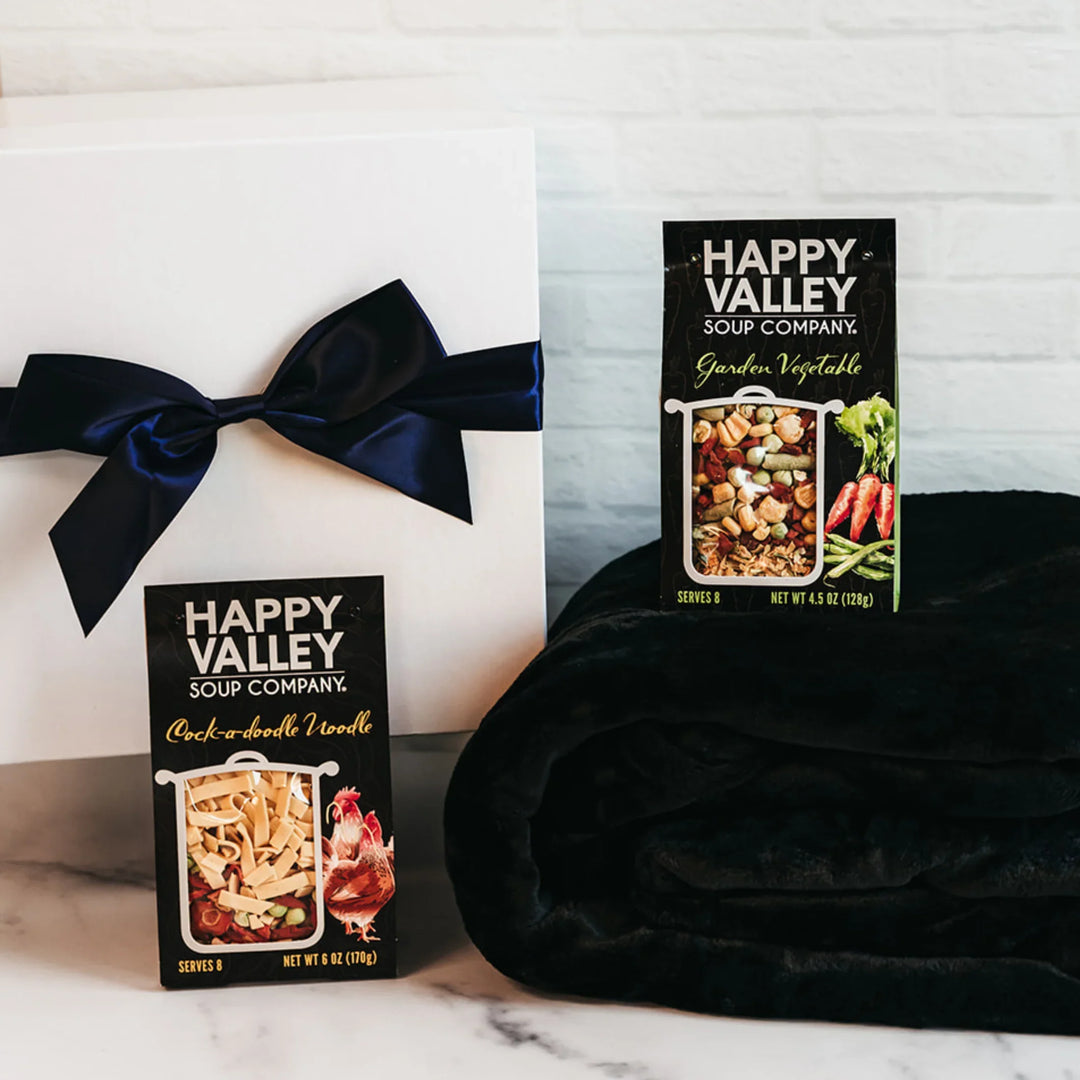 Winter Warm-Up Giften Box with soups and cozy fleece blanket.