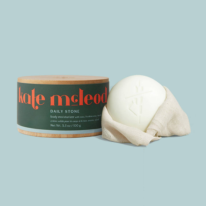 Kate McLeod Daily Stone lotion bar with bamboo canister