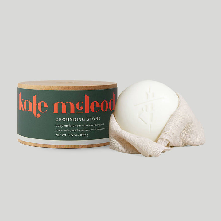 Kate McLeod Grounding Stone lotion bar with bamboo canister
