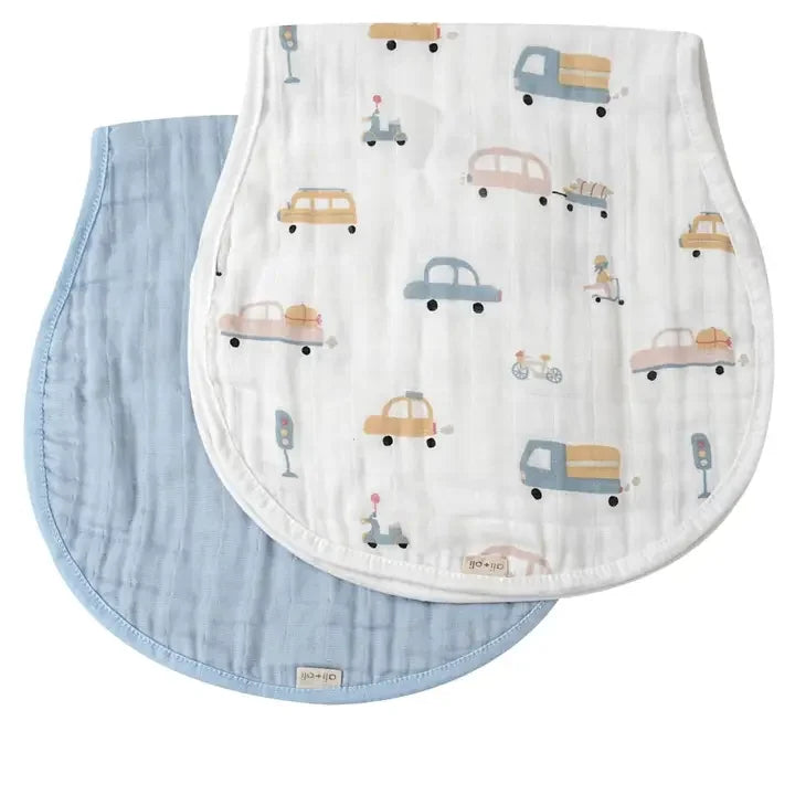Two bamboo muslin burp cloths, one blue and one with cars and traffic print, layered flat