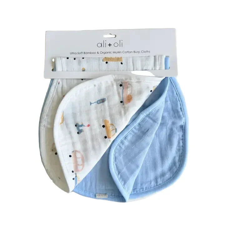 Set of two bamboo muslin baby burp cloths, one blue and one with car print, on hang tag packaging